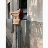 and white plaid suspender dress with slim waist and French retro temperament medium-length skirt HZ1024