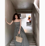 and white plaid suspender dress with slim waist and French retro temperament medium-length skirt HZ1024